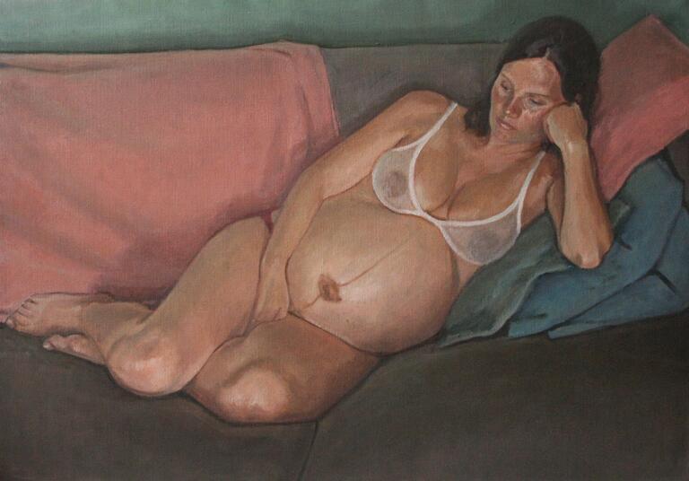 portrait of pregnant woman on sofa