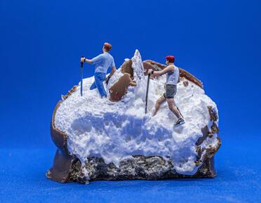 marsh mallow with two figurines walking on top 