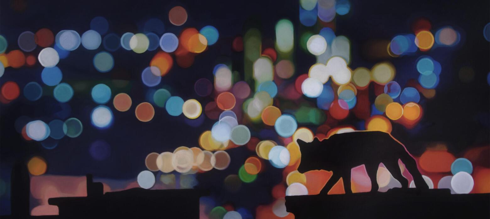 image of a fox on a roof with a glittering cityscape in the background