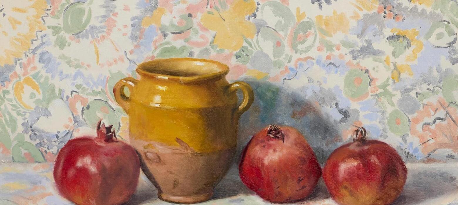 Still life of yellow pot and pomegranates