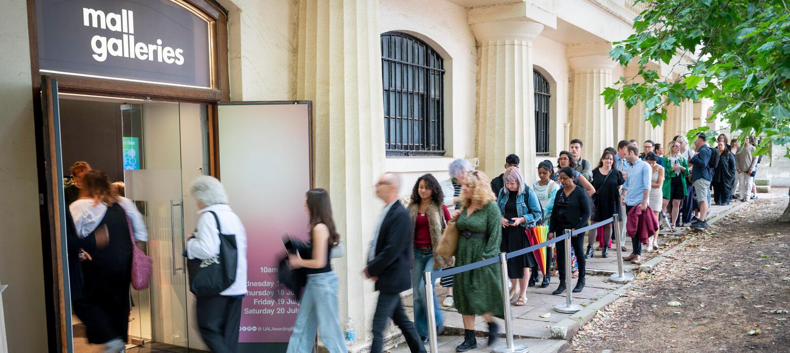 Image of people outside Mall Galleries