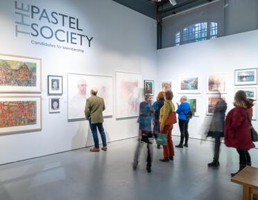 Crowd of people at Pastel Society Exhibition